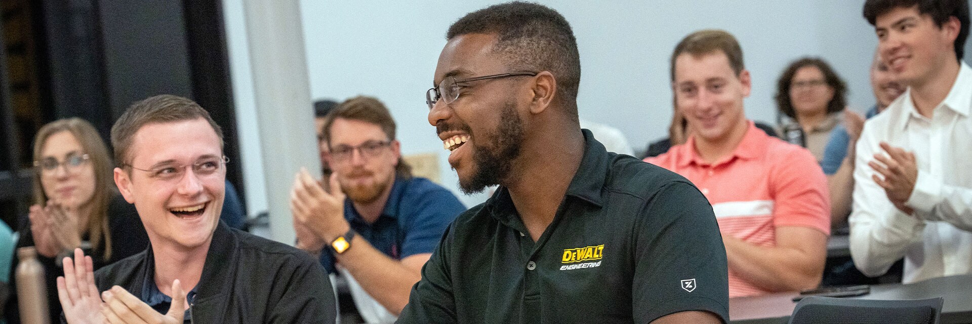 Stanley Black & Decker Leadership Program participants clapping for fellow peer.